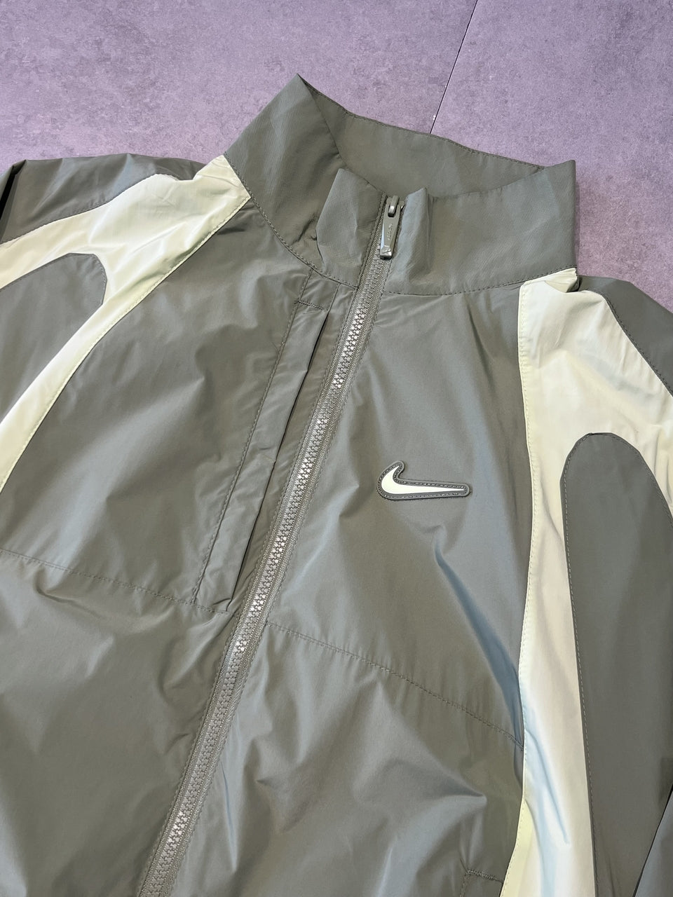 CORTA VENTO NIKE x NOCTA TRACK