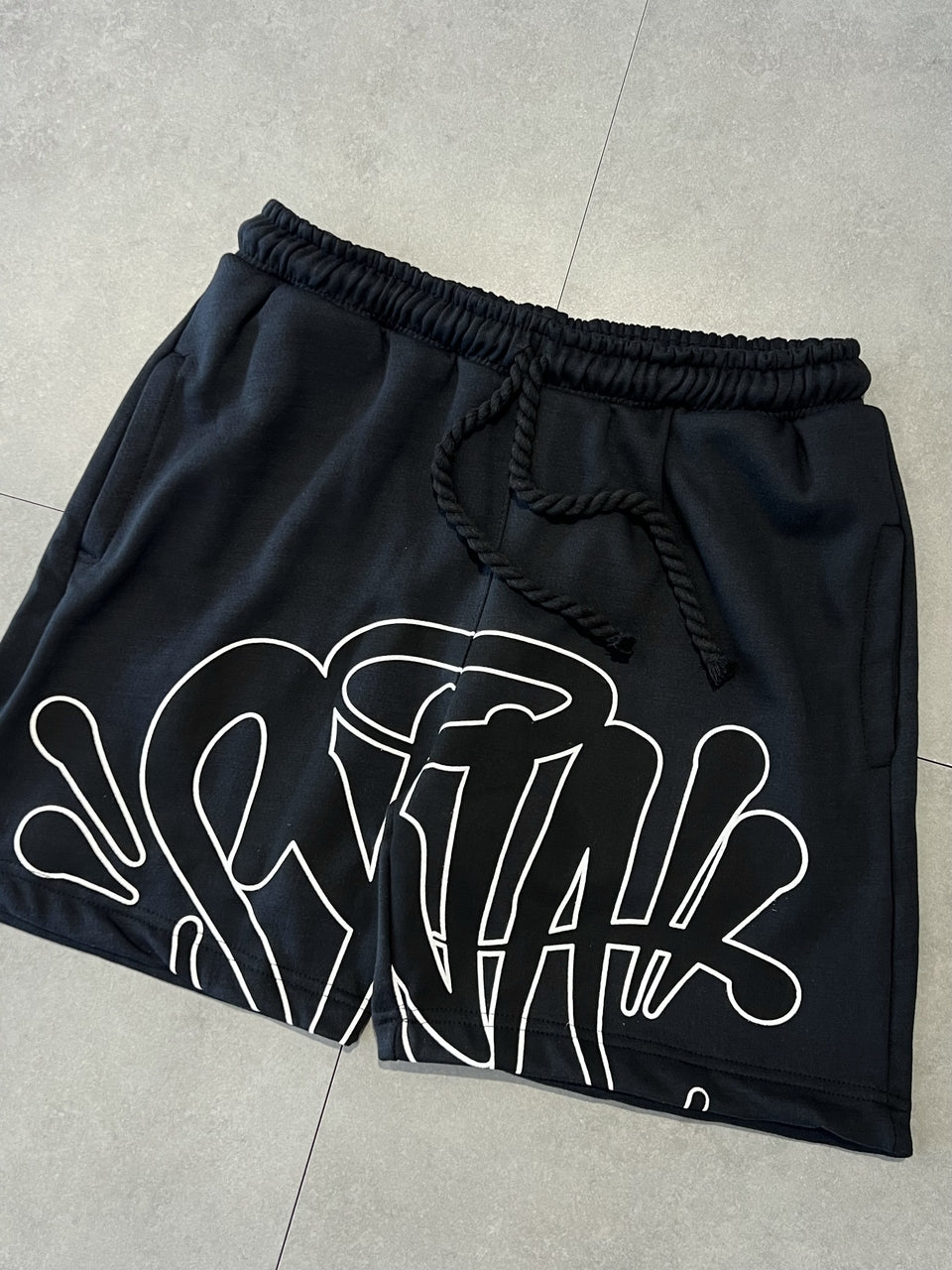 CONJUNTO SYNA WORLD LOGO