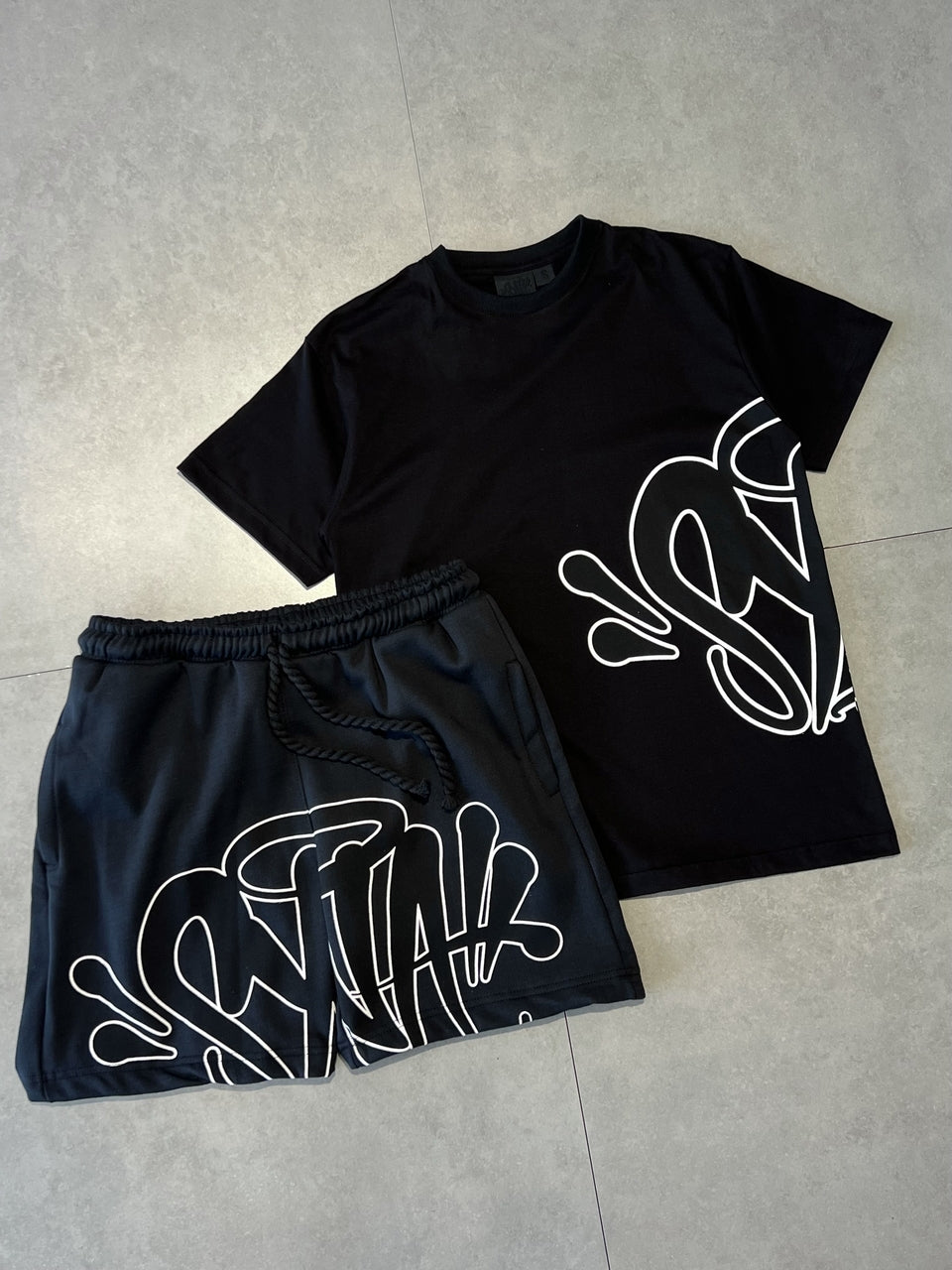 CONJUNTO SYNA WORLD LOGO