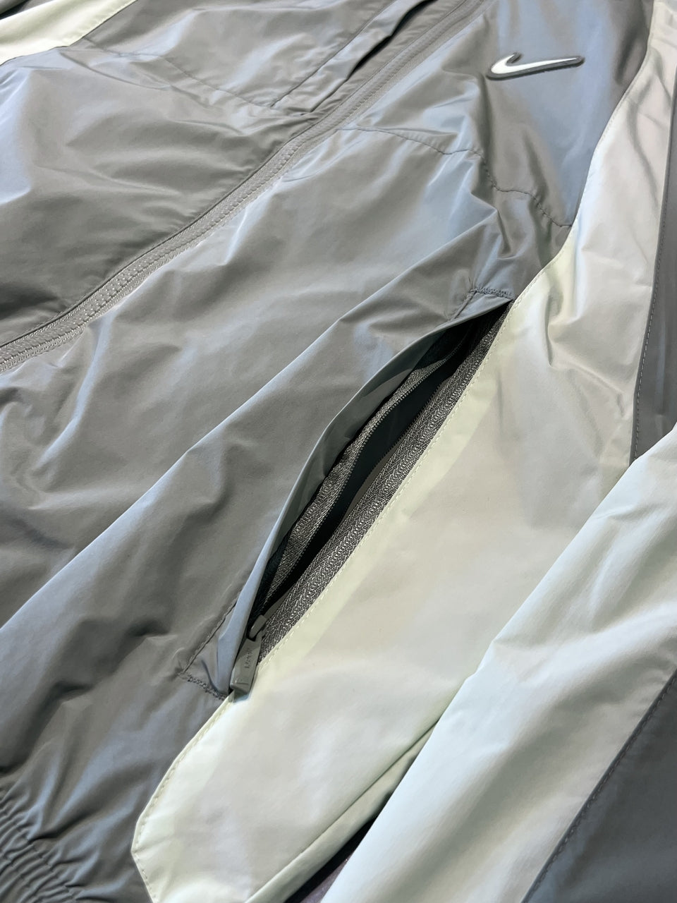CORTA VENTO NIKE x NOCTA TRACK