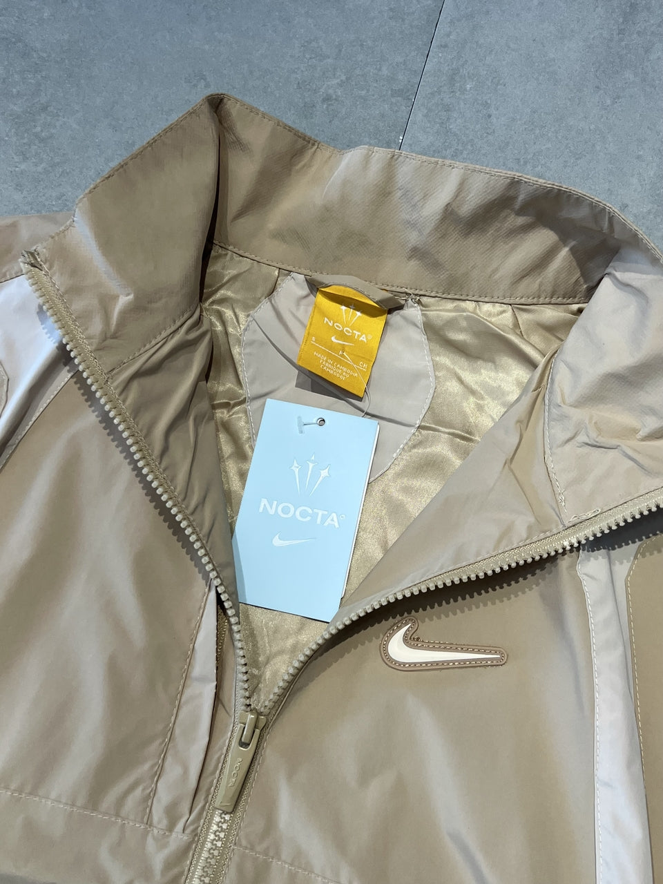 CORTA VENTO NIKE x NOCTA TRACK